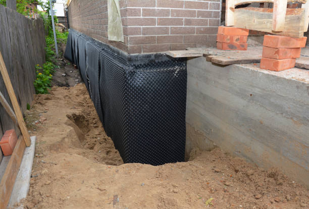 Happy homeowners after waterproofing job in Lizton